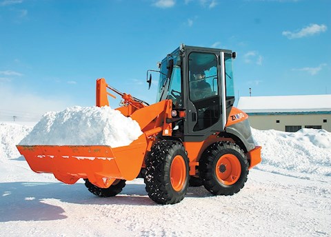 New Hitachi Loader lifting snow