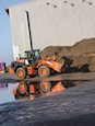 New Hitachi Loader with reflection in water for Sale