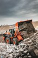 New Loader dumping rocks and material in pile for Sale 