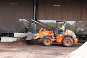 New Hitachi Loader moving debris on work site